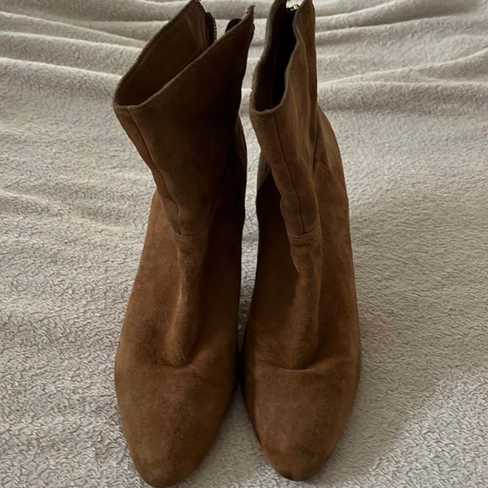 Tan suede booties in great condition. Tiny spot on heel seen in picture.